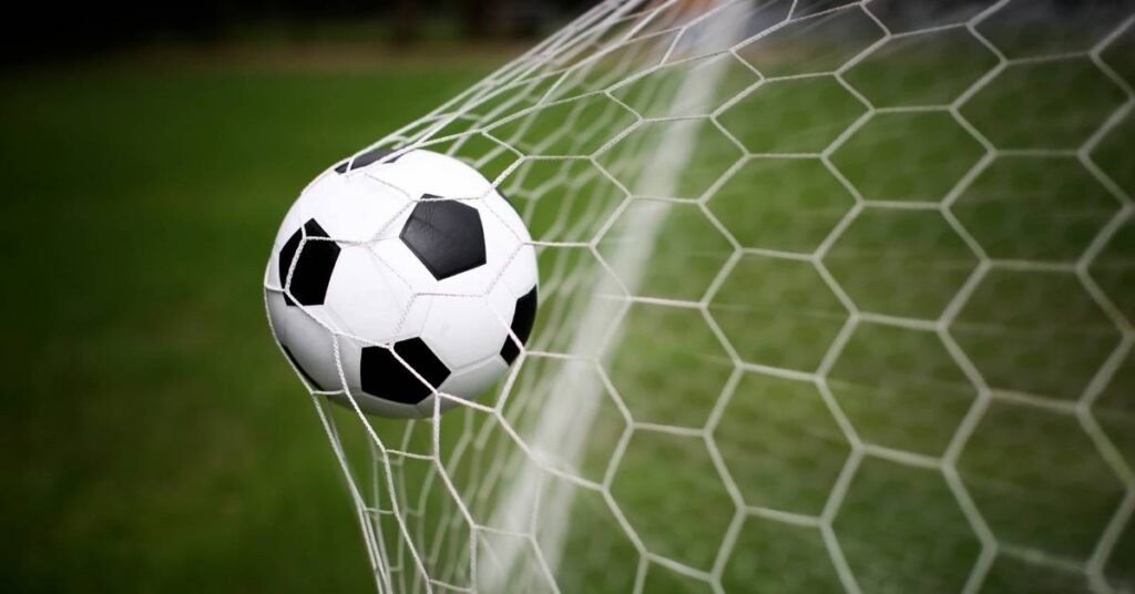 Image of a ball in the net after scoring a goal